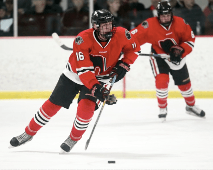 Sadek skates with the puck down the ice in the regular season. Photo by: Jim Lindquist